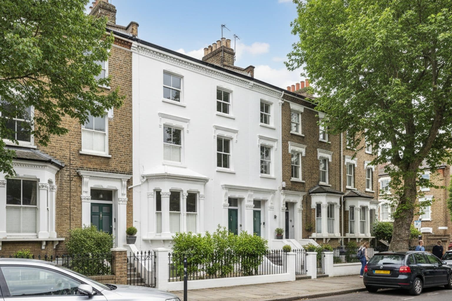 Clean white render on a period home after facade cleaning